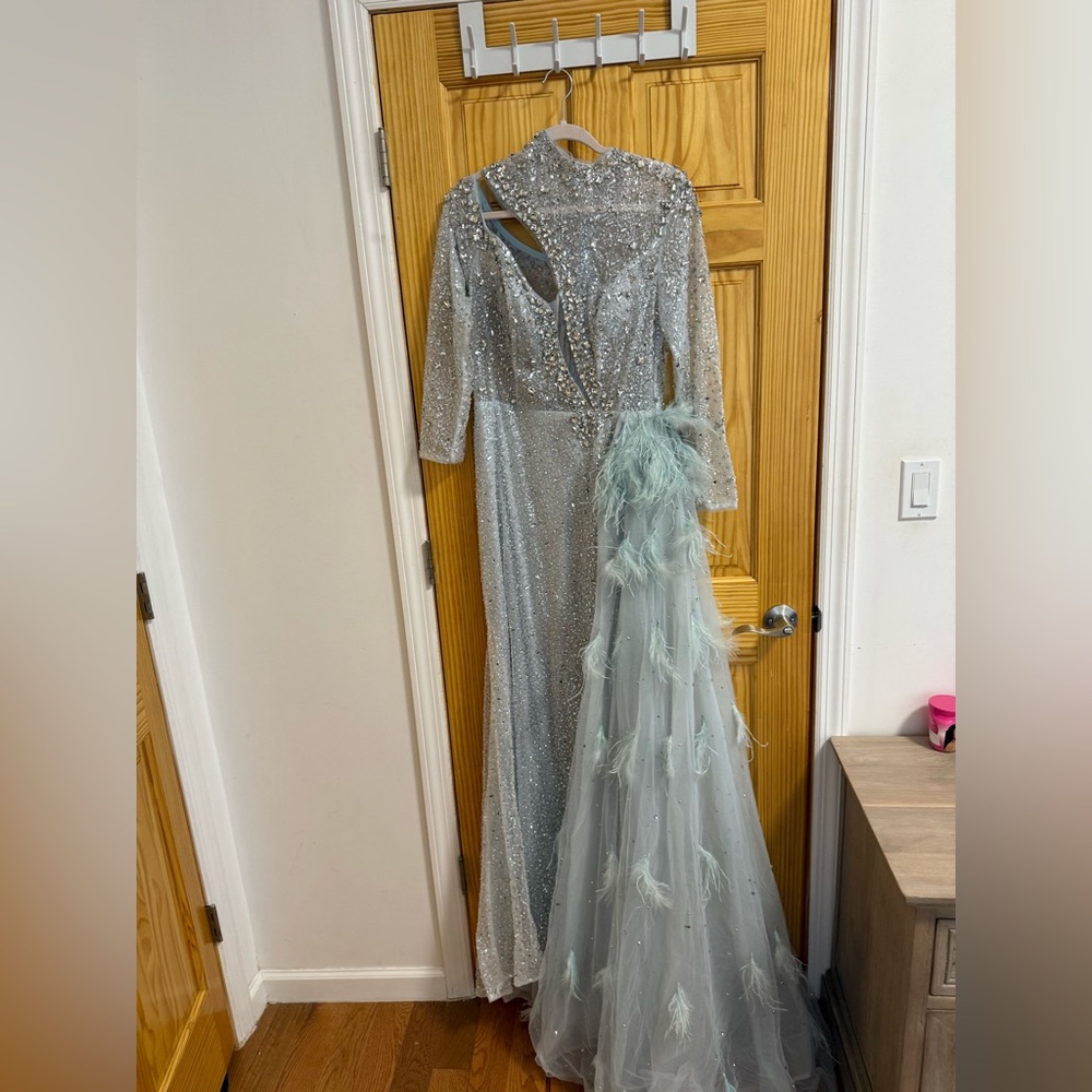 Beautiful mint green gown. Prom dress. Feather side skirt. Sparkly dress.